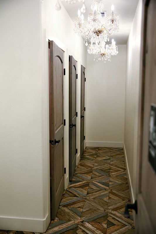 Chandeliers light up the Brides Restroom area at The Vista On Seward Hill