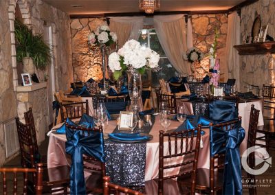 The dining room at The Vista On Seward Hill boasts beautiful chandeliers