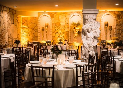 The dining room at The Vista On Seward Hill boasts beautiful chandeliers