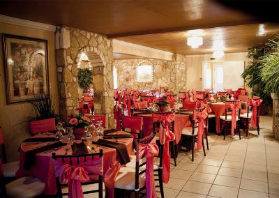 The dining room at The Vista On Seward Hill boasts beautiful chandeliers