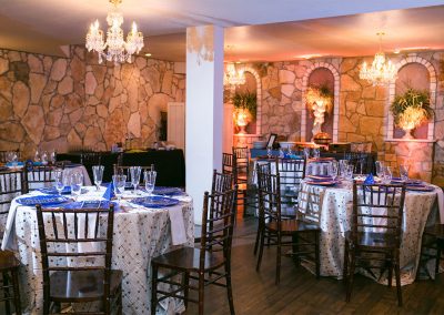 The dining room at The Vista On Seward Hill boasts beautiful chandeliers