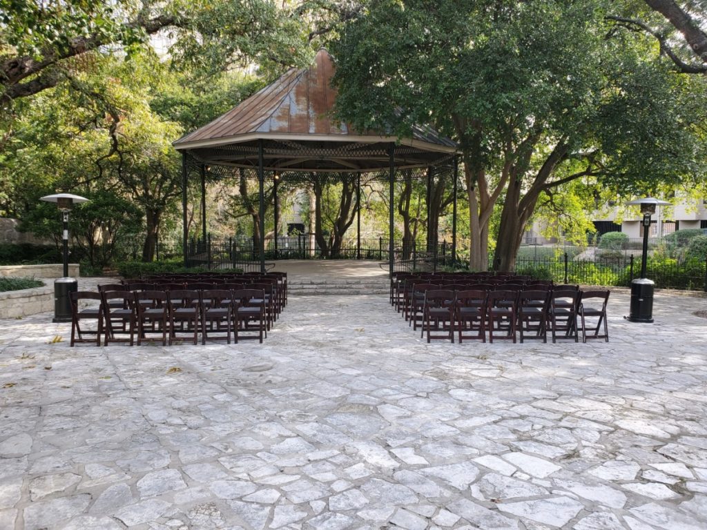 Mahogany Folding Chairs with Mushroom Heaters at Ceremony