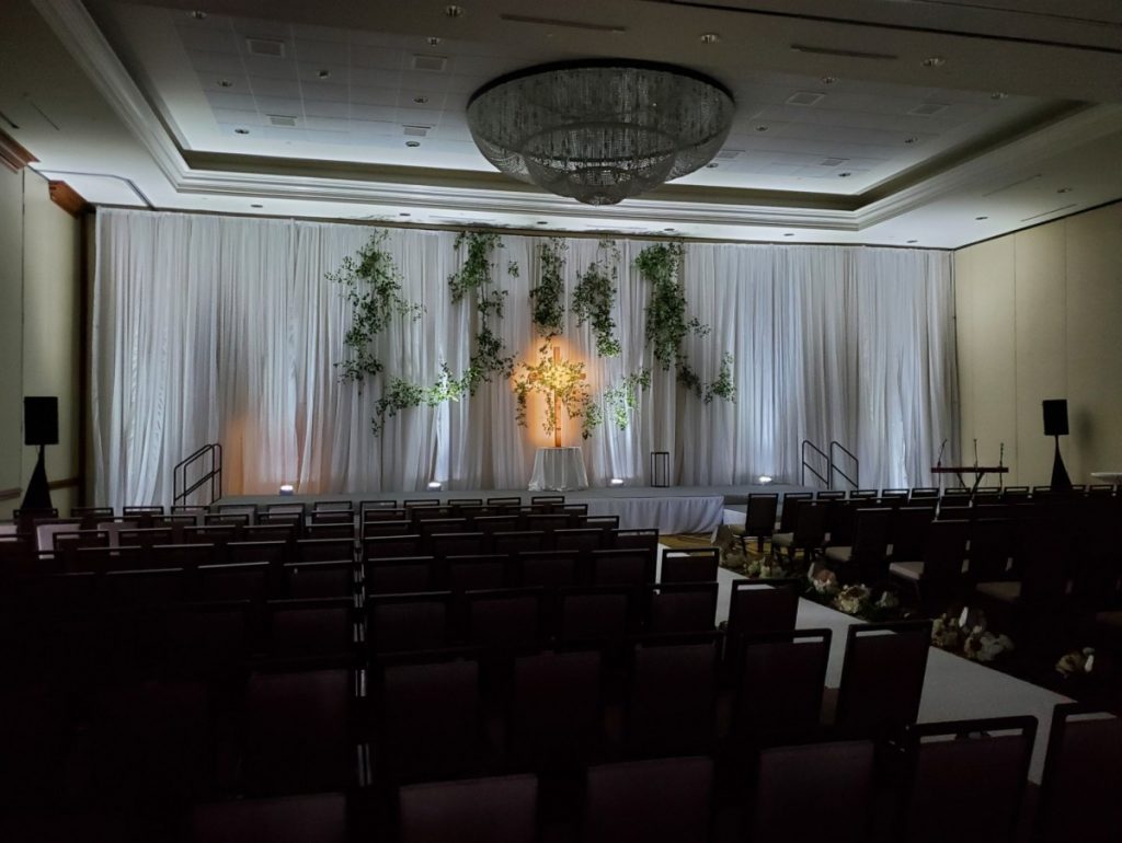White Sheer Pipe &amp; Drape with White Uplights at Ceremony