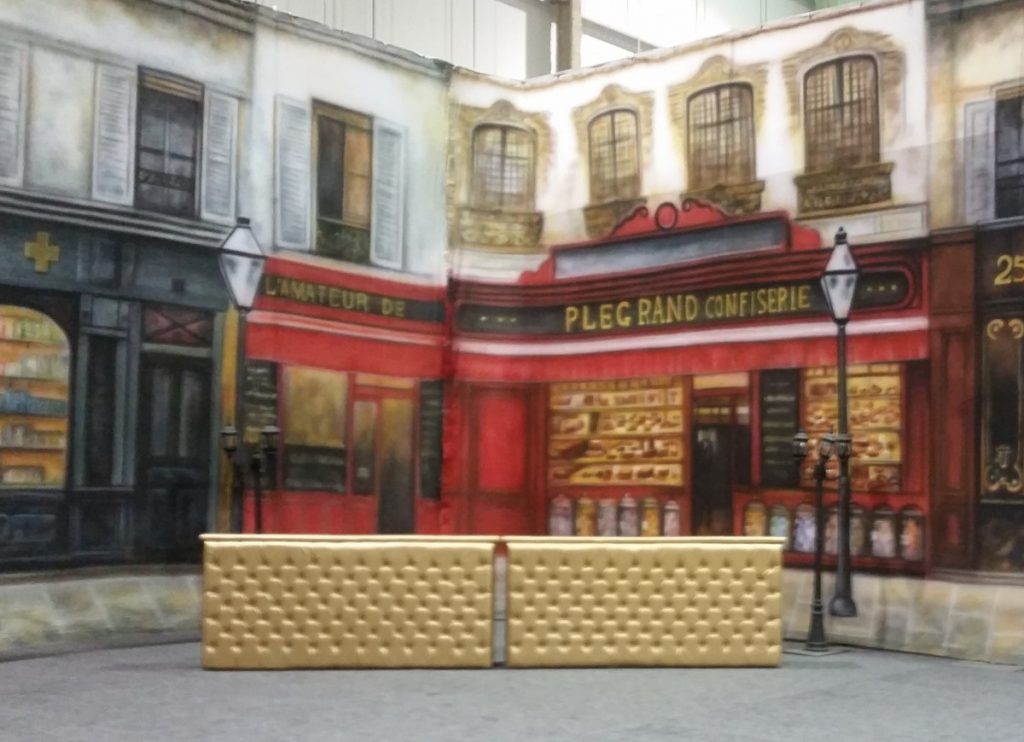 Gold Leather Tufted Bars with Facade Background